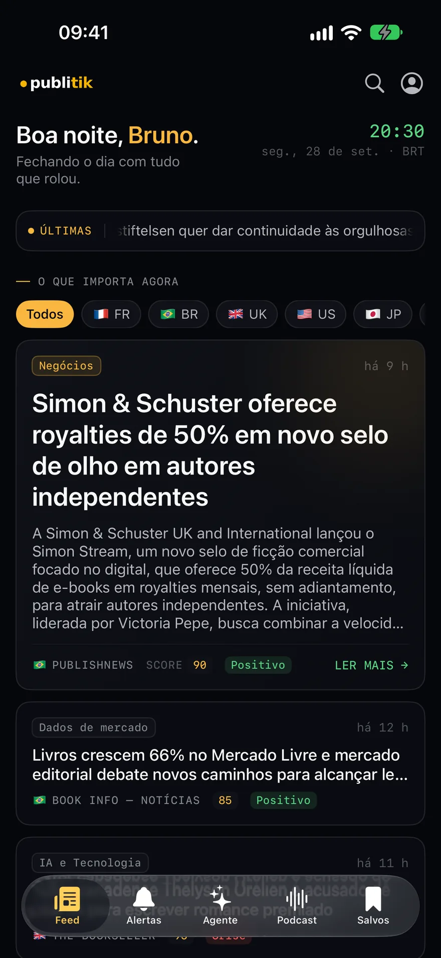 Tela inicial do aplicativo Publitik no iPhone, com a saudação do dia, os chips de país e as matérias mais relevantes